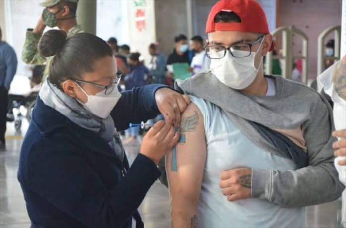A man in Mexico City receives a coronavirus vaccination.