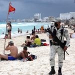 National Guard troops patrol a beach in Cancún, Quintana Roo.