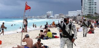National Guard troops patrol a beach in Cancún, Quintana Roo.