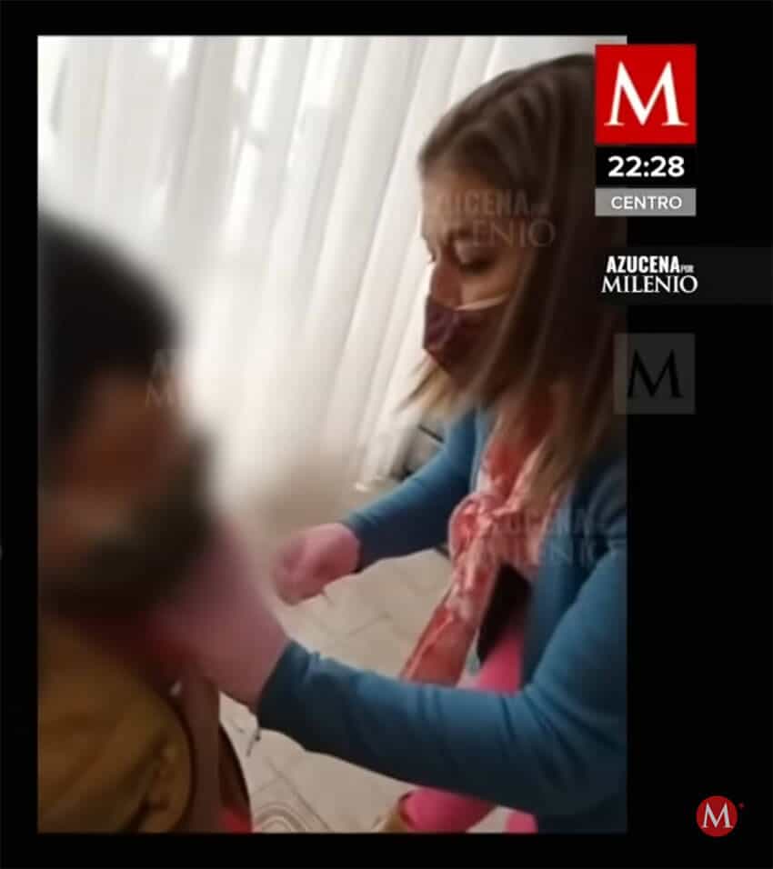 A woman injects a child with a supposed COVID-19 vaccine in footage obtained by the newspaper <i>Milenio</i>.