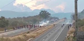 Police fire tear gas at protesting students.