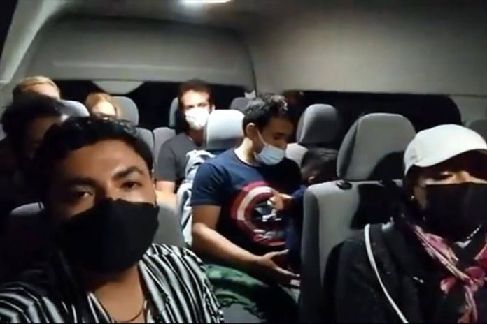 Travelers in one of the vans detained Tuesday evening filmed a bilingual video pleading for help from the government.