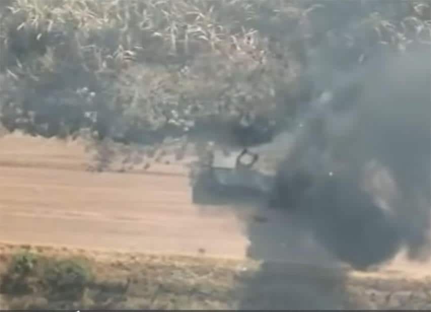 Aerial footage of the vehicle, still smoking after the mine explosion.