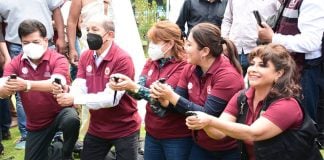 Mexico City borough mayors pose with axolotls before releasing them into the canals