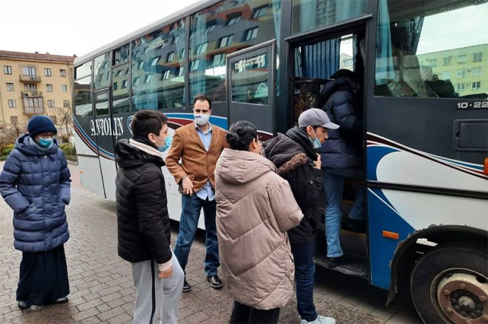 Mexican citizens board a bus in Ivano-Frankivsk, Ukraine on Friday, bound for Siret, Romania.