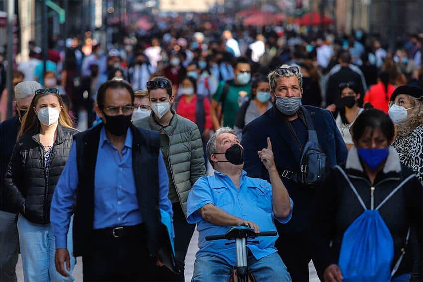 Face mask-clad pedestrians in downtown Mexico City, December 2021. A recent survey found that Mexico has one of the highest rates of mask usage in the Americas.