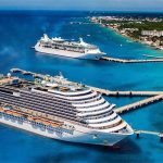 Two cruise ships dock in Cozumel, in 2019.