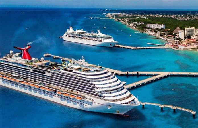 Two cruise ships dock in Cozumel, in 2019.