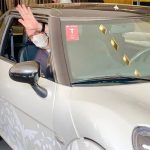 Foreign Affairs Minister Marcelo Ebrard waves from inside a Zacua electric car.