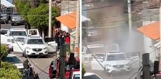 Video screenshots show the victims lined up in front of a house, before shooting started and they were engulfed in a cloud of dust.