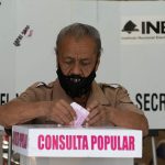 A man votes on a past referendum in Mexico City.