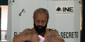 A man votes on a past referendum in Mexico City.