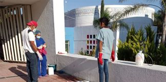 Workers clean up outside the Raymundo Abarca Alarcón General Hospital after the birth.