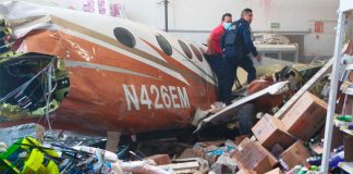 Wreckage of the plane inside a Bodega Aurrera store.