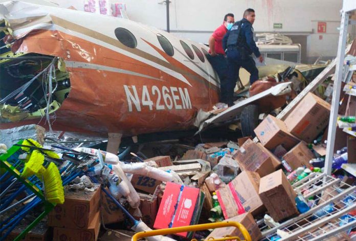 Wreckage of the plane inside a Bodega Aurrera store.