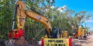 Greenpeace protesters at the train's construction site
