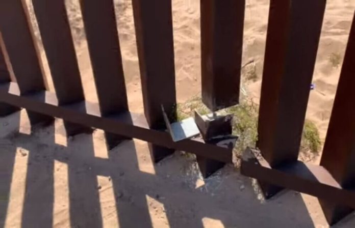 After using power tools to slice through a bollard, smugglers can push the dangling metal beam out of the way and walk through.