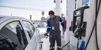 A gas station attendant at work in Tijuana.