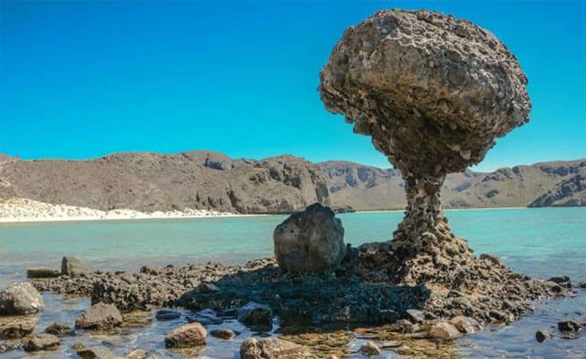 The Balandra natural protected area's famous mushroom rock formation, with Balandra Bay in the background.