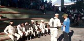 Community residents detained seven National Guard members in the town basketball court on Thursday.