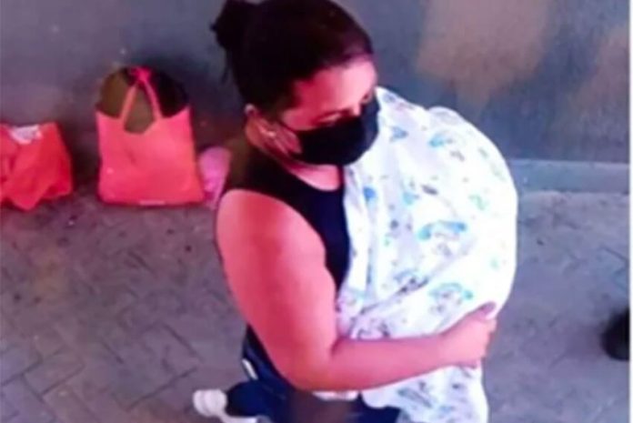 A surveillance camera captured a woman making off with the baby