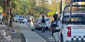 The students were traveling in a white pickup truck, center left, when the guardsmen began to shoot.