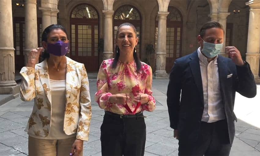 Smiling public officials, including Mexico City Mayor Claudia Sheinbaum, took off their face masks as they announced that it was no longer required to use them outside.