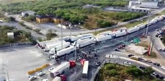 Truckers blocked the Pharr-Reynosa International Bridge on Monday to protest Texas' slow, thorough new inspection policy.