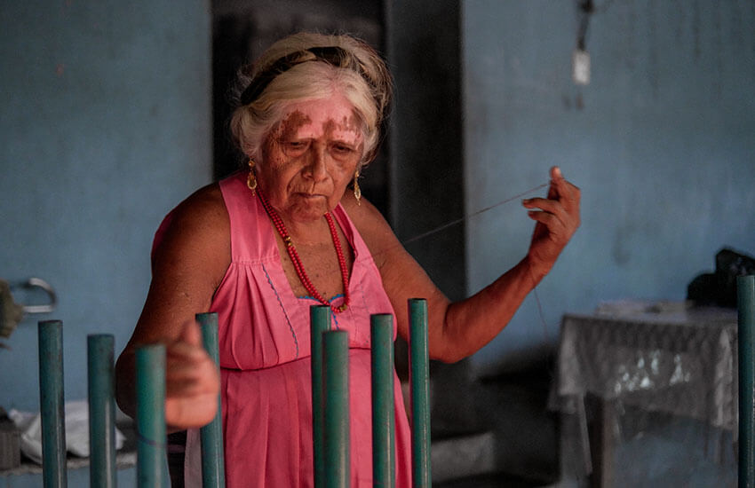 Mixtec woman weaving in Oaxaca town