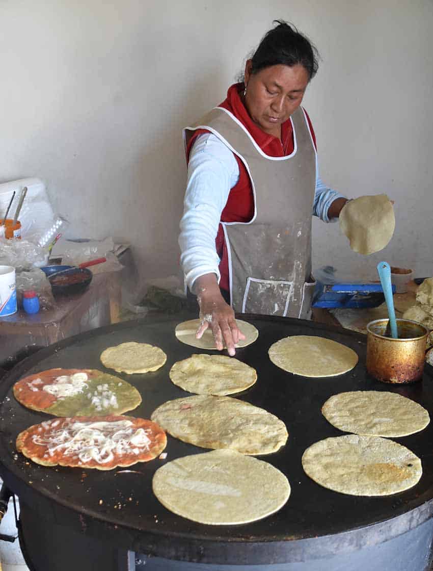 mexican woman making gorditas