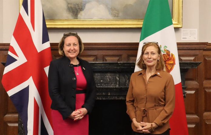 U.K. International Trade Secretary Anne-Marie Trevelyan, left, poses with Economy Minister Tatiana Clouthier, right.