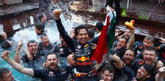 Checo Pérez celebrates his win with the Red Bull team.