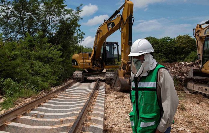 A construction crew works on a section of the Maya Train in Yucatán.