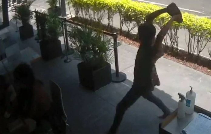 The unprovoked attack was caught by a restaurant security camera.