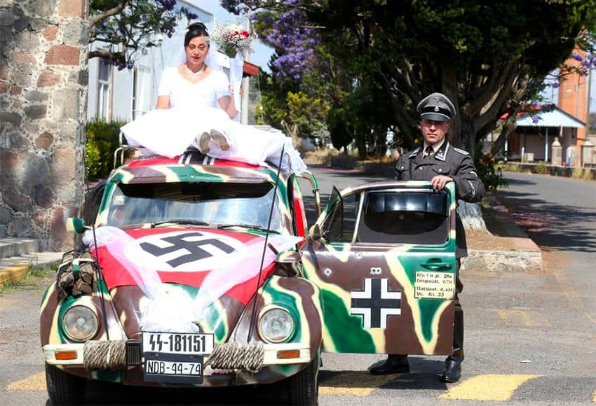 Nazi flag adorns the newlyweds' Volkswagen Beetle.