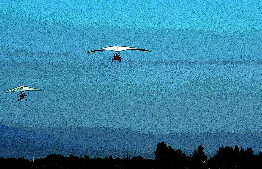 Trike pulling hand glider into air at Kordich Air Sports Jalisco