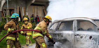 firemen putting out car fire in San Cristobal de Las Casas