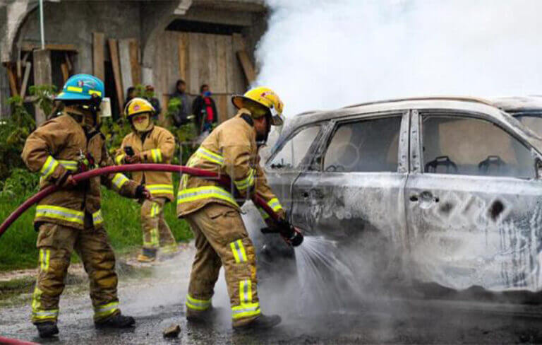 firemen putting out car fire in San Cristobal de Las Casas