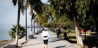 A woman jogs on the malecón of Lake Chapala in Ajijic, Jalisco.