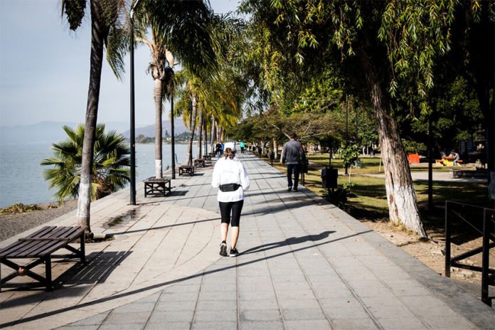 A woman jogs on the malecón of Lake Chapala in Ajijic, Jalisco.