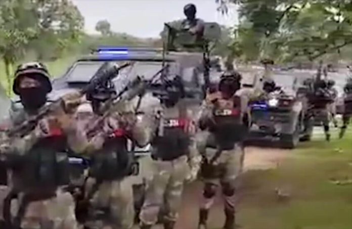 Purported Jalisco New Generation Cartel (CJNG) members show off gear in a video from 2020.