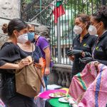 Shoppers and vendors wearing face masks at a market in Mexico City