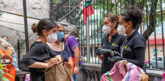 Shoppers and vendors wearing face masks at a market in Mexico City
