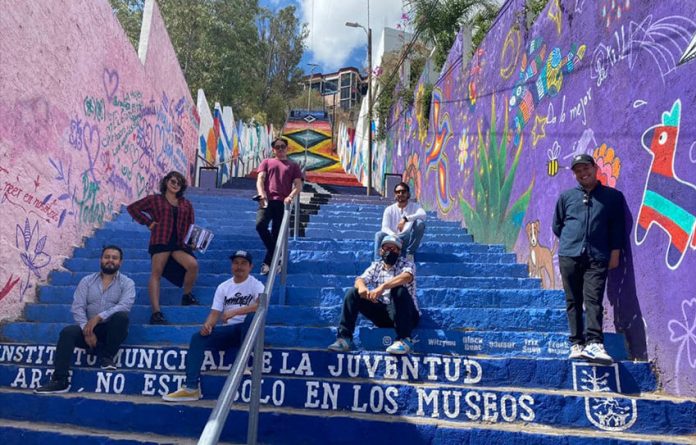 Participating artists pose on the stairs up Remedios Hill.