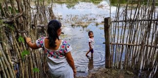 Cecilia Cahum Cahum and her niece Melany Ariana Cahum Chan hang out at the pond near their Maya community in the jungle, only a short drive and a hike away from bustling Tulum, Mexico.