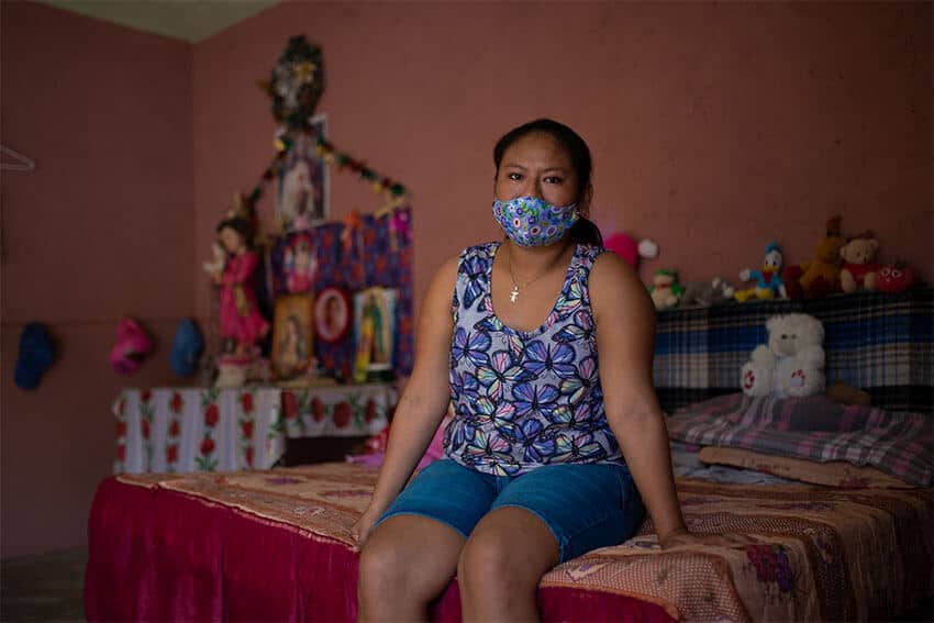 Laysa Guadalupe Yam Un sits in the room where she quarantined from her family when she came down with Covid. She was able to recover quickly at home, and none of her family members caught the virus. Laysa is a Maya farmer and a beneficiary of the Sembrando Vida program, and lives a few hours outside of the Riviera Maya.