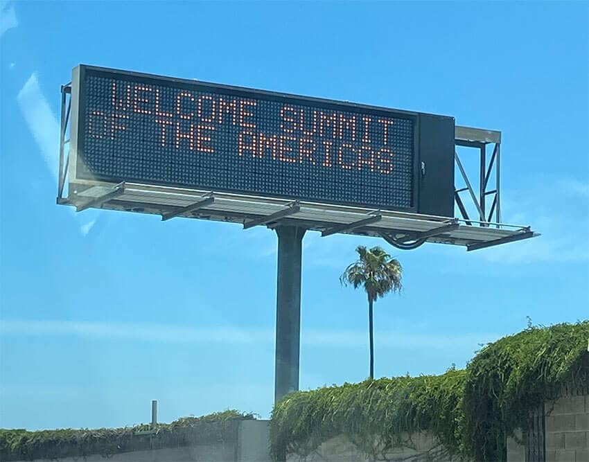 A Los Angeles highway billboard welcomes attendees to the Summit of the Americas, which started Monday without President López Obrador in attendance.