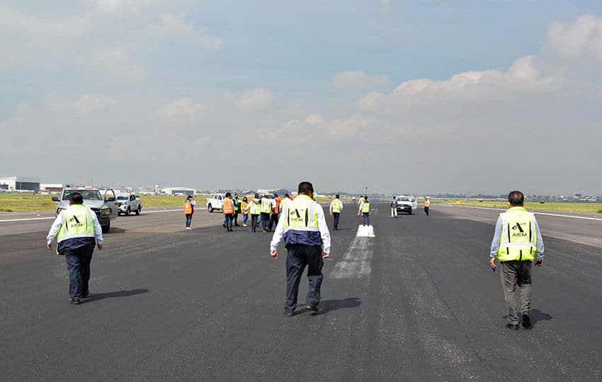 Workers on Mexico City International Airport runway