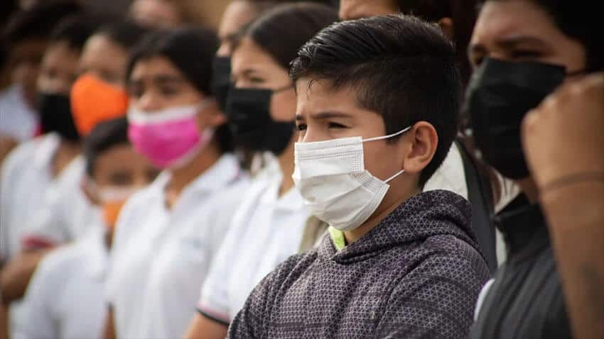 Students in Colima listen to a nurses instructions as they get ready to receive a COVID vaccine.