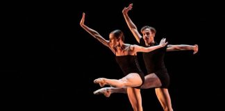 Two dancers perform, in a Danzatlán 2022 promotional image.